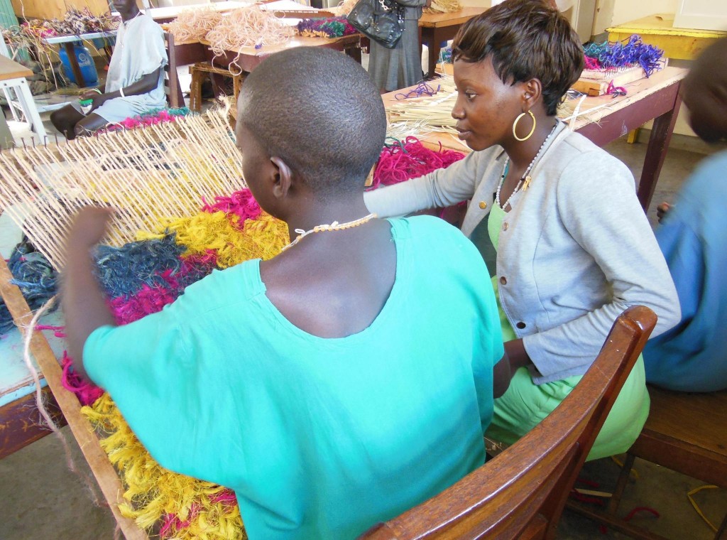 Psychiatric patient expressing themselves through traditional art at Butabiika 